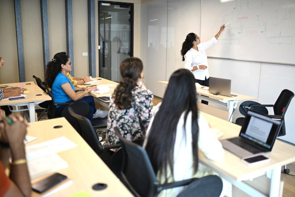 Educator teaching learners in a professional classroom environment